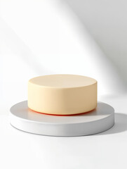 Minimalist cream-colored cake on a modern pedestal, showcasing elegance and simplicity in a well-lit setting