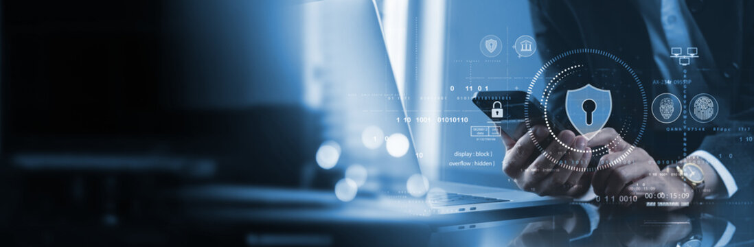 Cyber security network. Data protection concept. Businessman using laptop computer and mobile phone with padlock on network security technology with cloud computing, data management, cybersecurity - Powered by Adobe