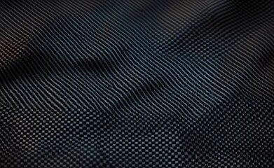 Obraz premium Close-Up Carbon Fiber Texture Background with Intricate Weave Patterns and Deep Detail