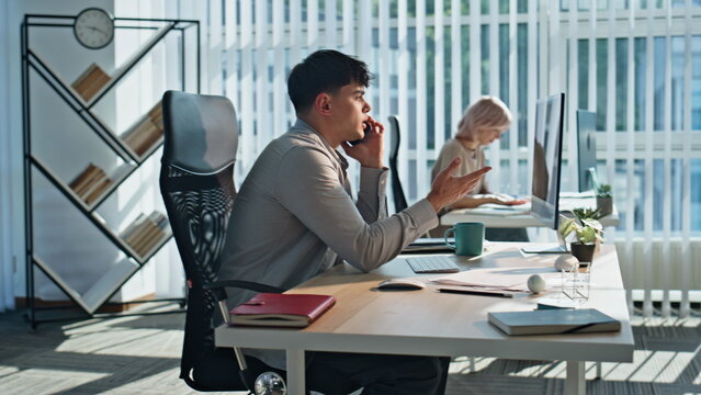Confident professional speaking smartphone coworking office. Closeup man calling