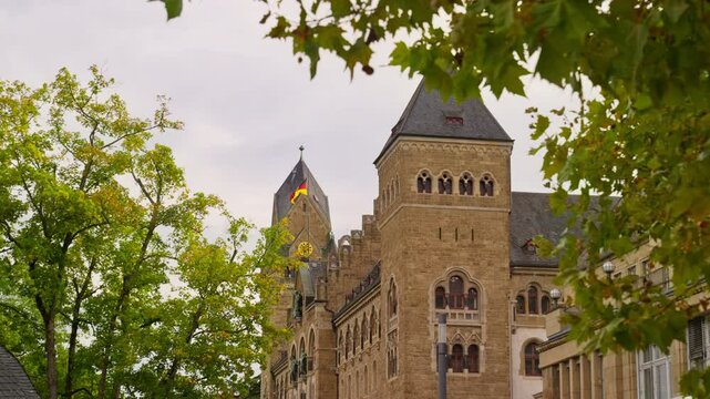 Moving towards the Court of Appeal, or Oberlandesgericht, through blowing trees, Koblenz, Rhine River Valley Germany
