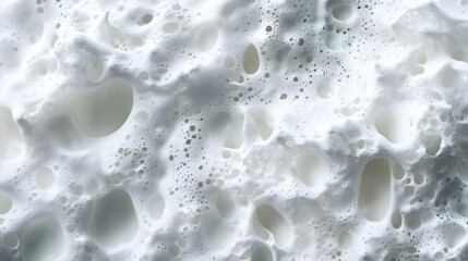 Close-up view of white foam, highlighting its textured surface and intricate bubble formations. Abstract and visually appealing. A Close-Up Study of Bubbles and Airy Forms