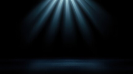 Fototapeta premium Dramatic Blue Spotlight Illuminates Textured Floor Against Black Background