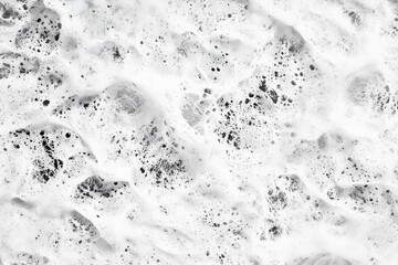Close-up Photograph of White Foam with Dark Gray Flecks