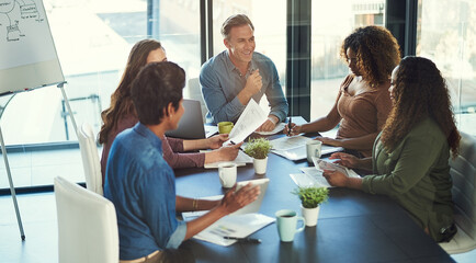 Obraz premium Business people, documents and happy at meeting with finance, budget or team with collaboration at startup. Men, women and planning with smile, results or review for revenue with diversity at company