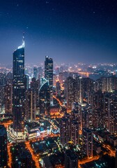 Obraz premium A breathtaking view of a modern metropolis at night, featuring illuminated skyscrapers, a starry sky, and a vibrant skyline.