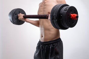 Obraz premium Person Lifting Dumbbell for Fitness and Strength Training Workout