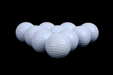 golf balls on black