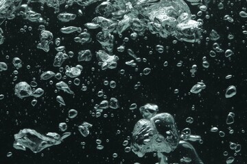 Many water bubbles on black background, closeup
