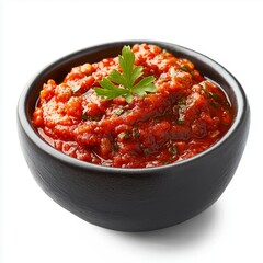 Vibrant red salsa in black bowl with fresh parsley garnish