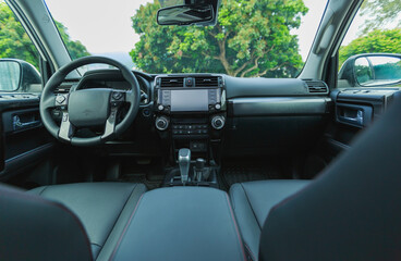 Interior of new off road car in forest mountains