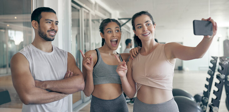 Selfie, fitness or happy friends at gym with coach for exercise, health or influencer with picture. Photography, group or people workout at club for social media, excited or point at personal trainer