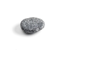 A minimalist black and white photograph of a single, perfectly smooth, grey stone resting on a stark white background, shot with shallow depth of field, emphasizing texture and form.
