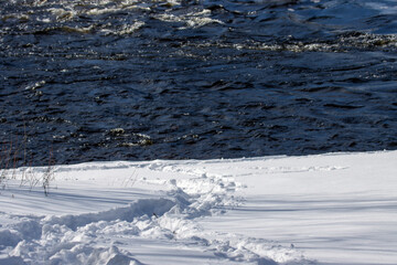 snow-covered banks of a river during winter