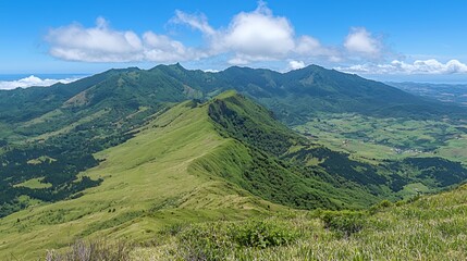 Obraz premium Expansive Green Mountain Landscape Under a Blue Sky