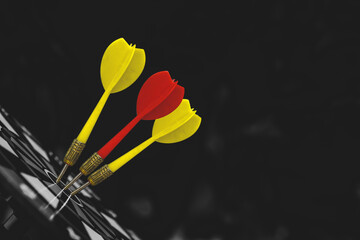 Dark bulls eye target or bullseye have red dart arrows throw hitting challenge the center of a...