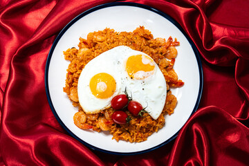 Kimchi fried rice with shrimps and topped eggs - Asian and fusion food style