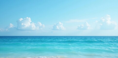 Obraz premium Tranquil blue sea meets soft blue sky; gentle waves , serene scene, landscape