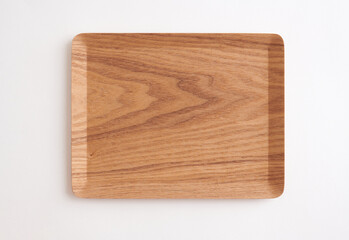 Rectangular wooden tray with natural grain texture, isolated on white background. Top view