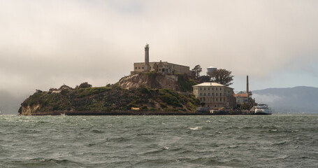 Picture of prison island in bay with old buildings and lighthouse