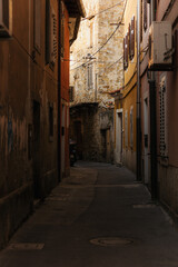 Fototapeta premium Urban Alleyway with Shadows