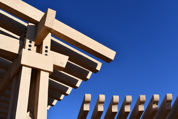 Large wooden structure in city park.