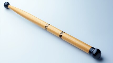 Naklejka premium Light Brown Drumstick With Black Accents On Light Blue Background