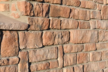 Angled shot of red brick wall.