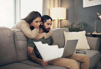 Finance, couple and laptop with paperwork on sofa for budget planning, mortgage insurance and...