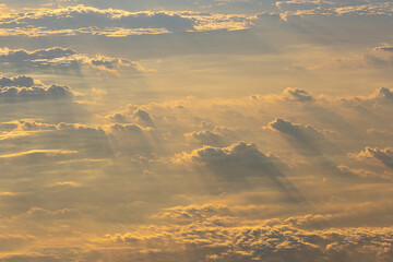 smooth clouds in the sky in the morning and Sunbeams view high angle from airplane