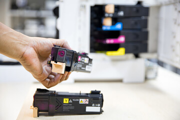 Technician Holding ink printer toner low for replace new or fix repair problem paper or print...