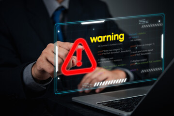 Cybersecurity warning concept. businessman pointing screen red alert sign, cyber threats, hacking risks, and system vulnerability. Digital security breach warning with a futuristic online threats.