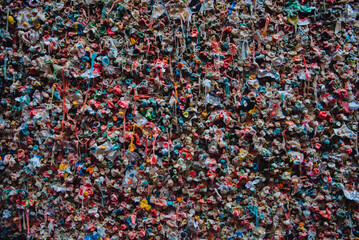 Art of chewing gum covered of different colored famous Seattle wall background.