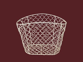The dark red background in the picture is a white wire mesh basket with a beautiful white honeycomb pattern that can be used to hold various things. It has two handles on each side and is beautifully 