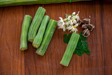 Moringa oleifera, Moringa leaves, Moringa flower, Moringa seed on wood background
