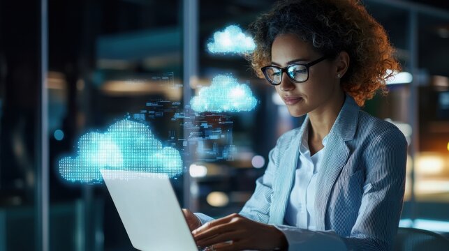 A woman is using a laptop in front of a screen with clouds