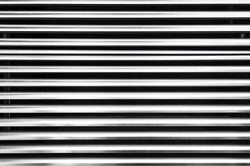Obraz premium Horizontal metal lines create a striking pattern with light and shadow in a minimalist design