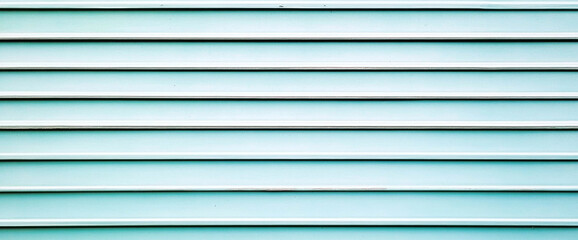 Obraz premium Horizontal lines of light blue siding against a plain backdrop