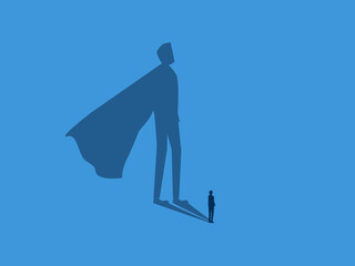 confidence concept, strength ,Businessman in the spotlight shines on the shadow of a super hero © Yoona