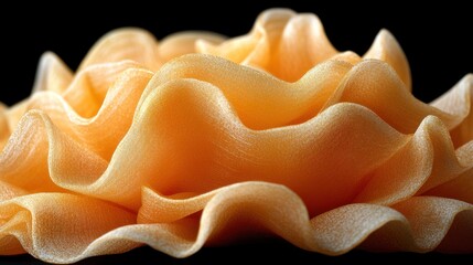 Orange pasta waves, dark background, food photography