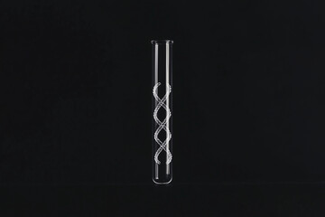 DNA Helix in a Vial: A transparent glass vial holds a delicate representation of the DNA helix, set against a dark background, symbolizing the essence of scientific discovery.