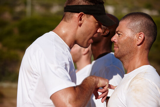 Bootcamp, discipline and pointing with drill sergeant shouting at recruit for military training outdoor. Aggression, anger and patriotism with soldier man yelling at private for intense army workout