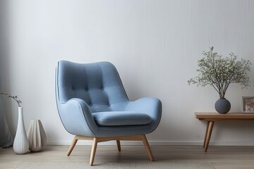 Scandinavian-inspired living space featuring a blue fabric armchair, clean white walls, soft wooden flooring, simple and cozy atmosphere, minimal but stylish home decor.