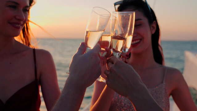 Group of business friends together celebrating and enjoying party with drinking champagne on sail yacht, Outdoor lifestyle of the sea  and travel vacation concept