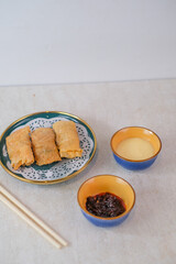 Crispy Shrimp Spring Rolls Perfectly Fried To Golden Brown Served With Creamy Mayonnaise And Spicy Chili Sauce For A Delicious Appetizer And Snack.