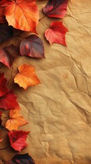 Obraz premium A beautiful arrangement of autumn leaves spread across a textured brown paper background evoking seasonal warmth