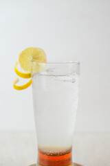 Chilled Sparkling Honey Lemon Drink With Fresh Lemon Garnish And Vibrant Honey Layer In A Tall Glass For A Refreshing And Flavorful Experience.
