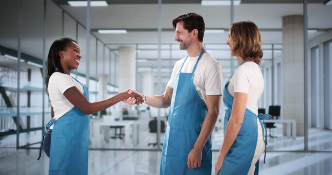 New commercial janitor greets diverse cleaning staff