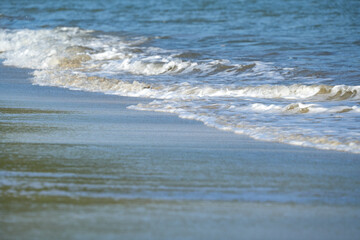 The sea water on the beach is a wave of various forms for background.