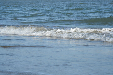 The sea water on the beach is a wave of various forms for background.